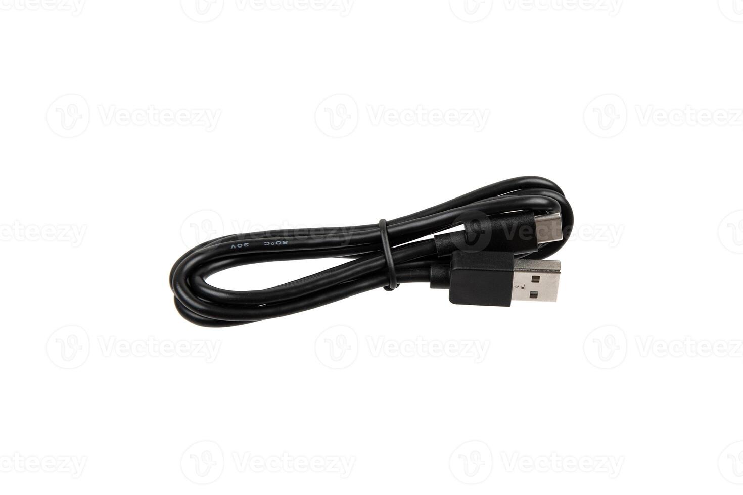 Black USB cable with two connectors, neatly coiled and secured with a strap, isolated on a white background. photo