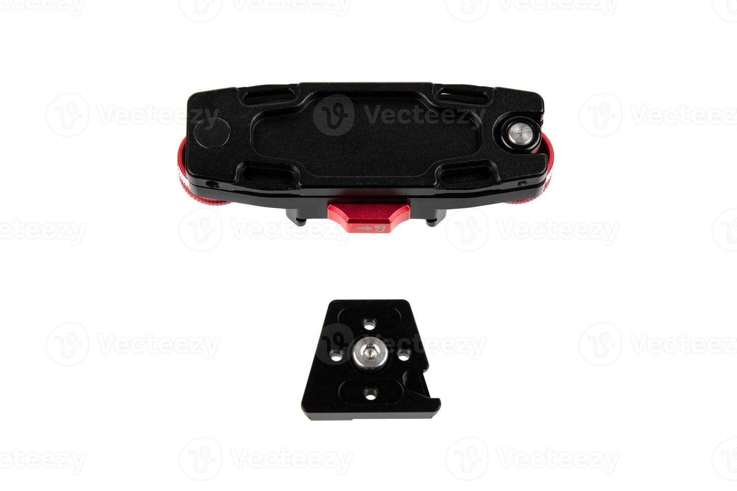 A camera quick-release plate and clamp with red adjustment knobs, designed for securely mounting cameras on tripods, highlighting its functionality and robust design. Isolate on white back photo