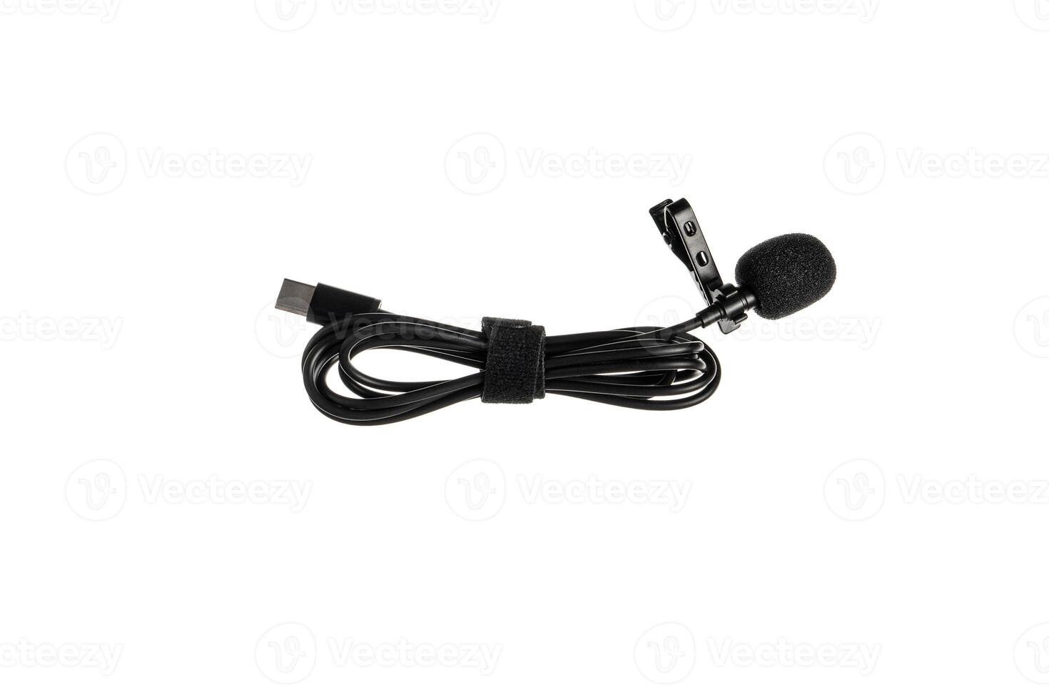 A black lavalier microphone with a foam windscreen and a USB-C connector, neatly coiled with a Velcro strap, isolated on a white back photo