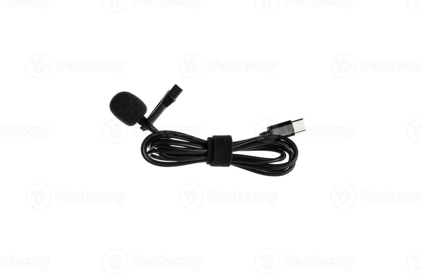 A black lavalier microphone with a foam windscreen and a USB-C connector, neatly coiled with a Velcro strap, isolated on a white back photo
