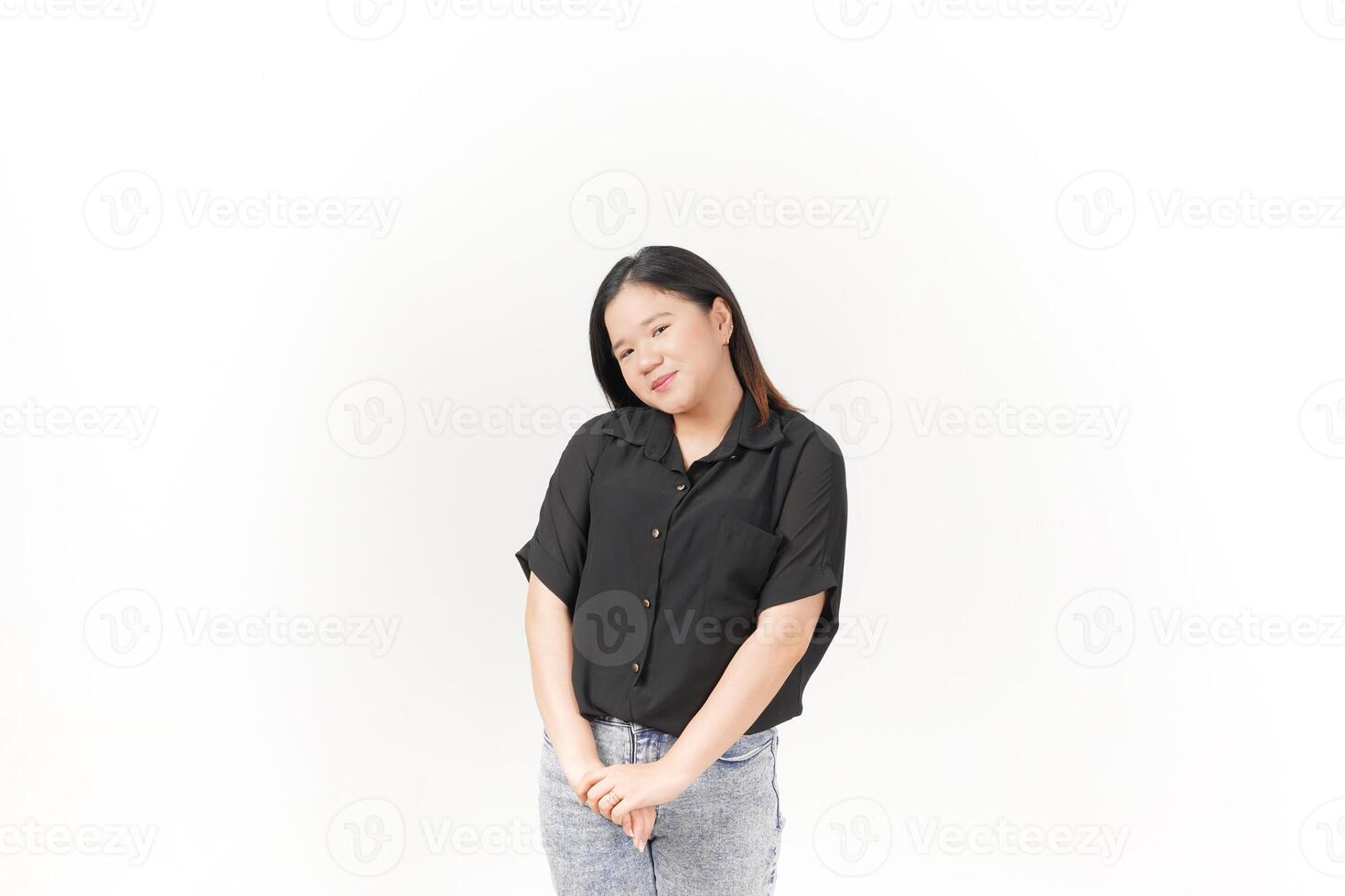 beautiful Asian woman smiles warmly, striking a cute, playful pose against a plain white background photo