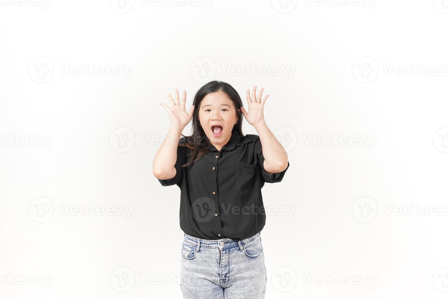 beautiful Asian woman displays a shocked expression, with wide eyes and open mouth, against a white background. photo