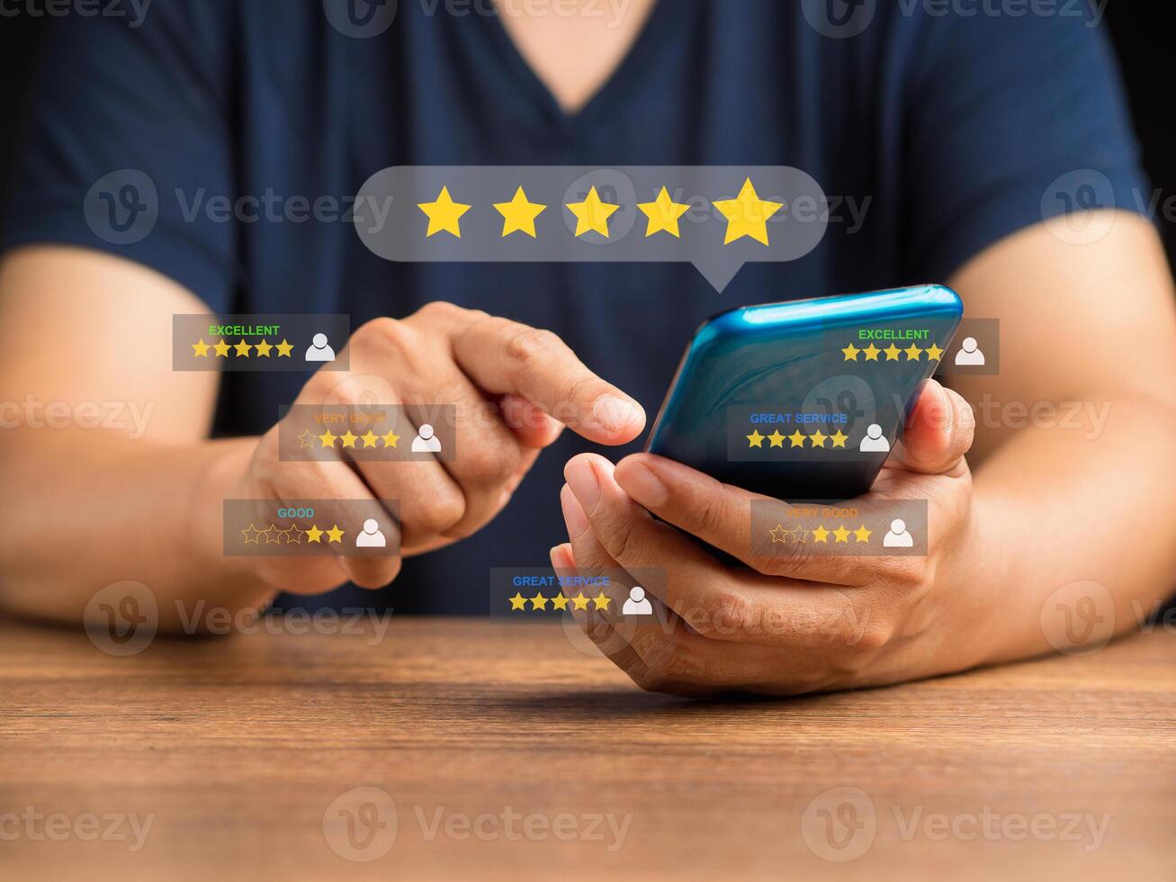 Man using a smartphone give the five-star icon a rating of very impressed for service photo