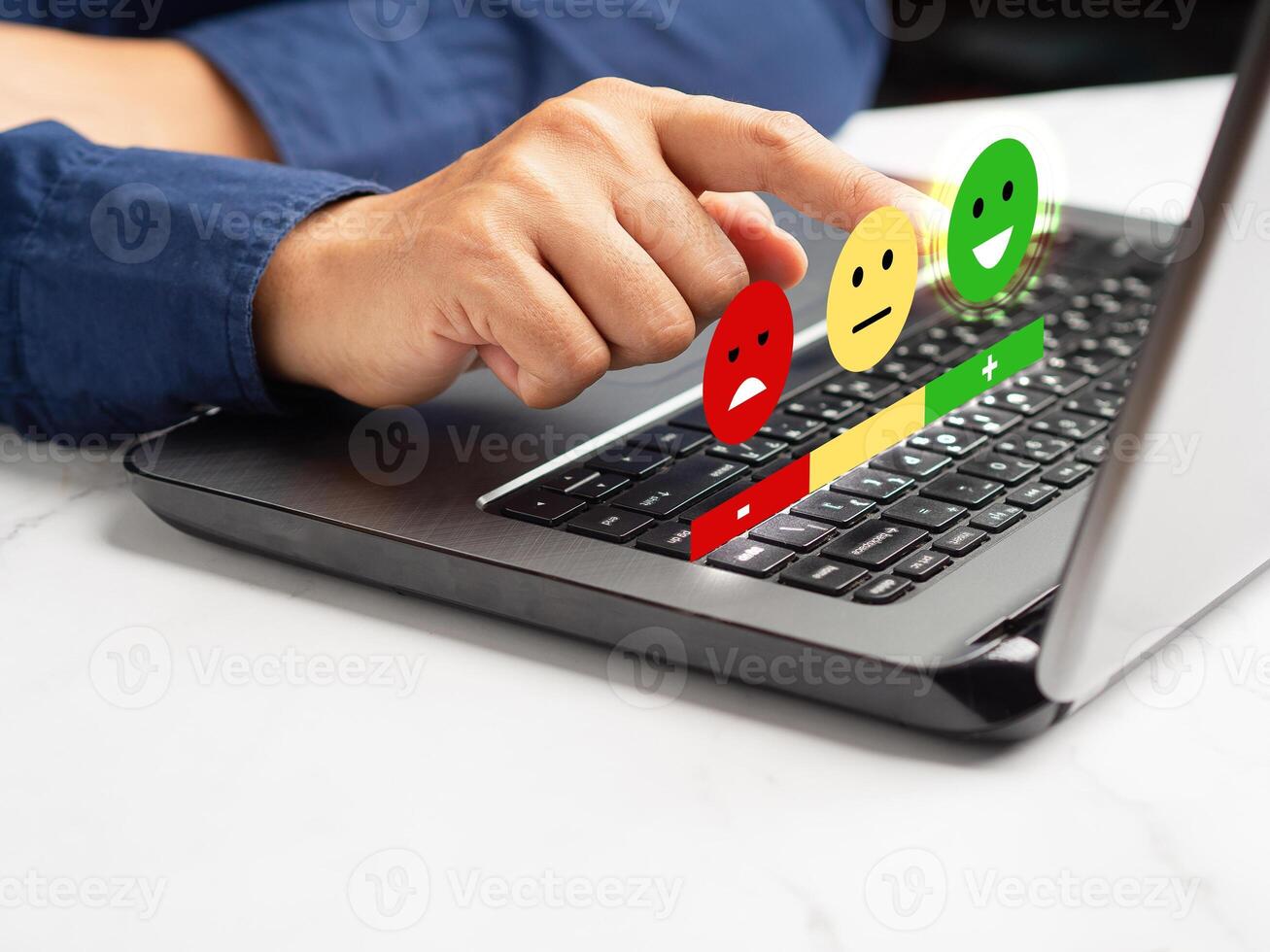 Positive feedback concept. Choosing a green happy mood icon rating review in the survey, poll, or customer satisfaction research on a virtual screen photo