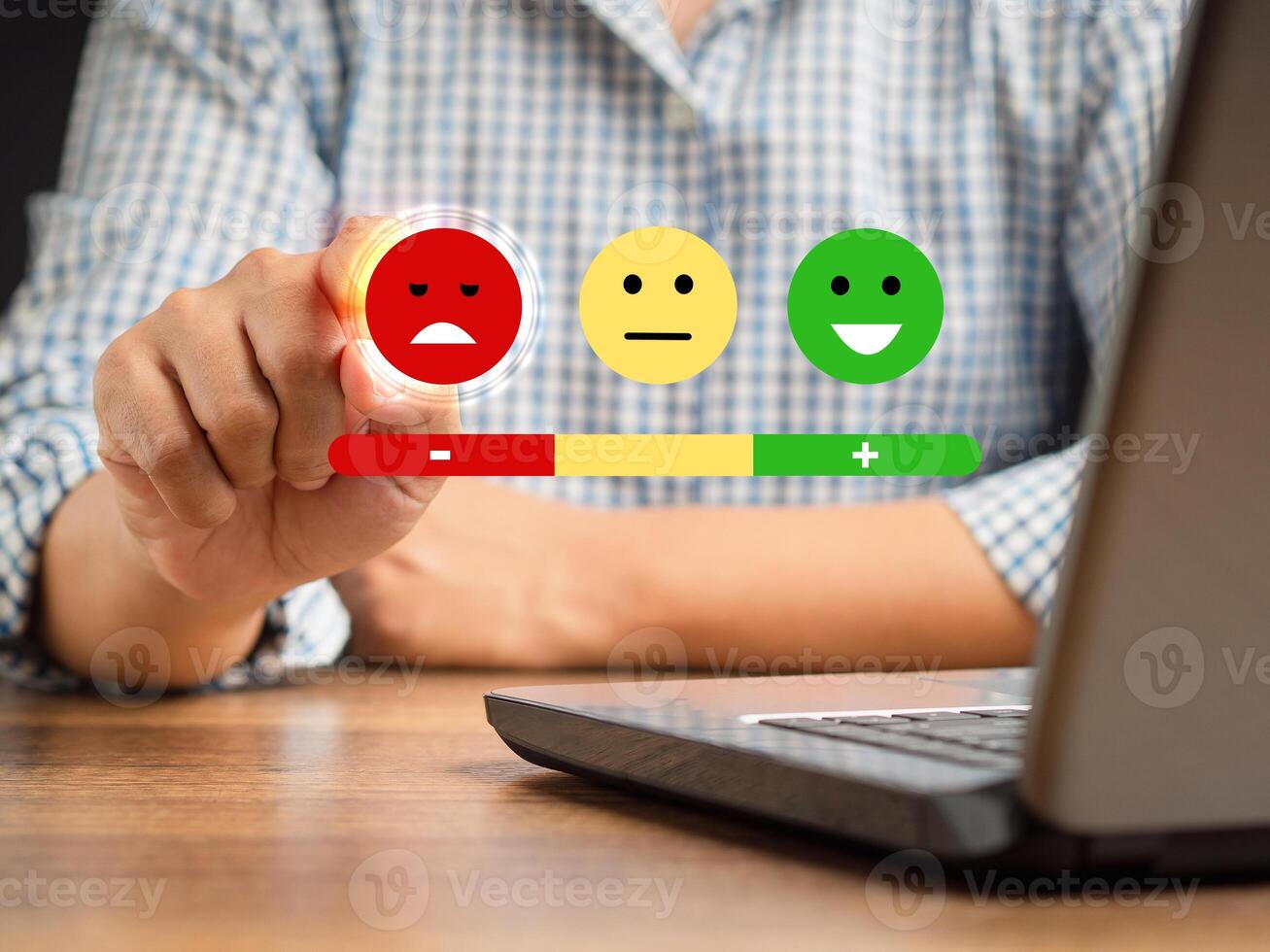 Negative feedback concept. Choosing a red sad mood icon rating review in the survey, poll, or customer satisfaction research on a virtual screen photo