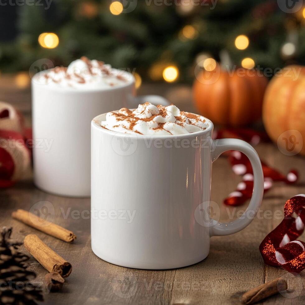 Two white mugs with whipped cream and cinnamon on a wooden table photo