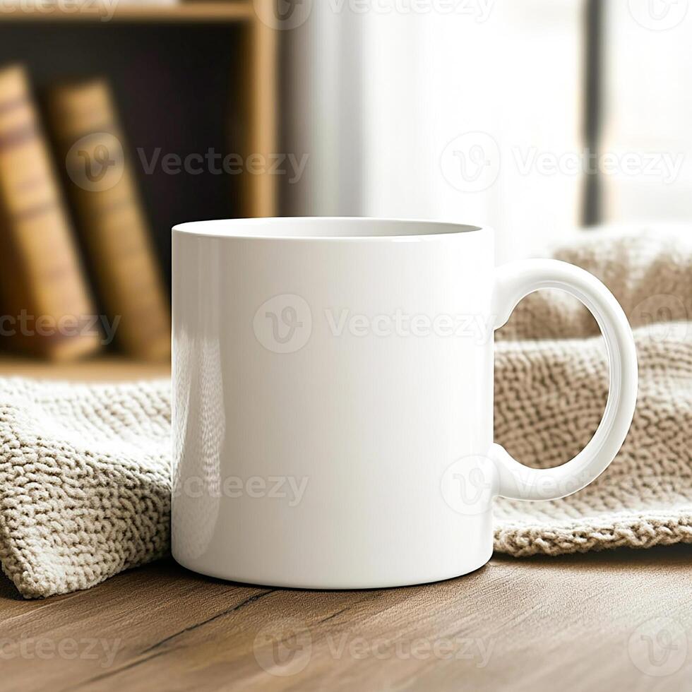 A white mug on a wooden table with books photo