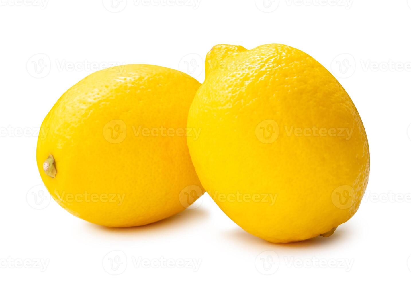 Side view of two fresh ripe yellow lemon fruit in stack isolated on white background with clipping path photo