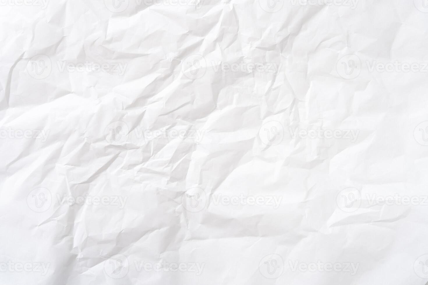 Top view and full frame of wrinkled or crumpled white stencil paper texture used for wrinkled or crumpled white paper background texture in decorative art work photo