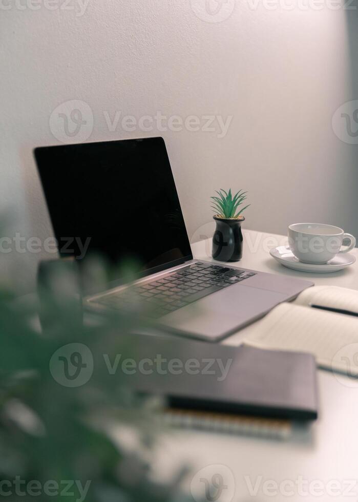 Remote work relies on technology, with employees using laptops and computers from home to communicate and conduct business online via network. comfortable, display, efficient, electronic, minimalist. photo