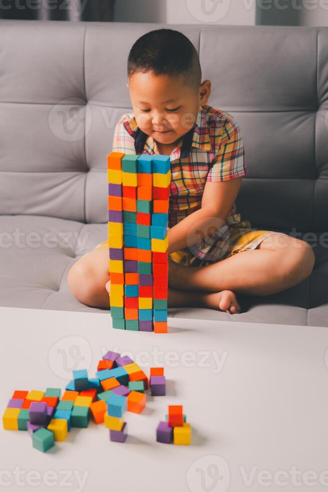 Children enjoy colourful game with educational toy blocks that make play fun activity, enhancing their development during childhood. gathering, creation, exercise, inspiration, improvement, practice. photo