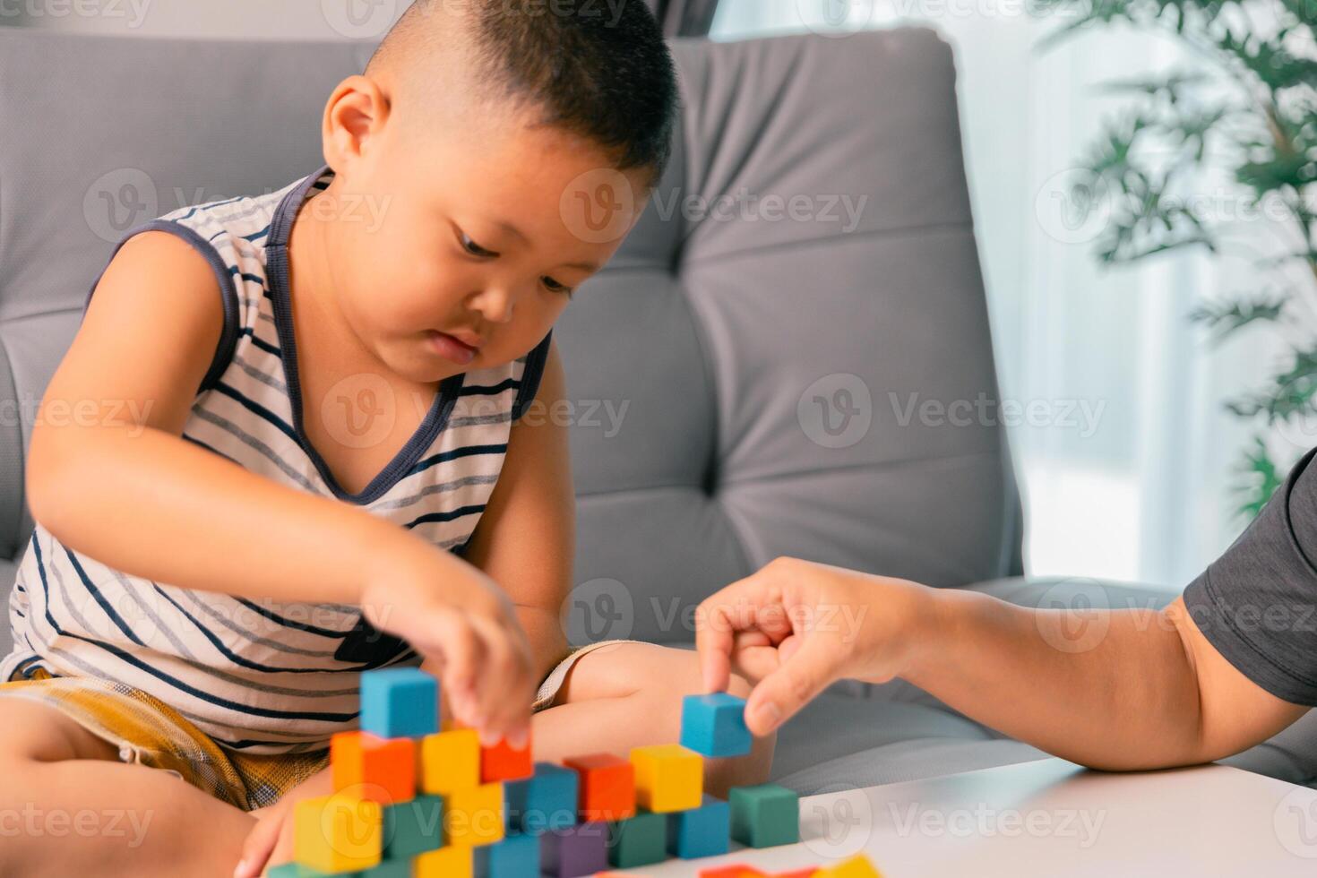 Children enjoy colourful game with educational toy blocks that make play fun activity, enhancing their development during childhood. gathering, creation, exercise, inspiration, improvement, practice. photo