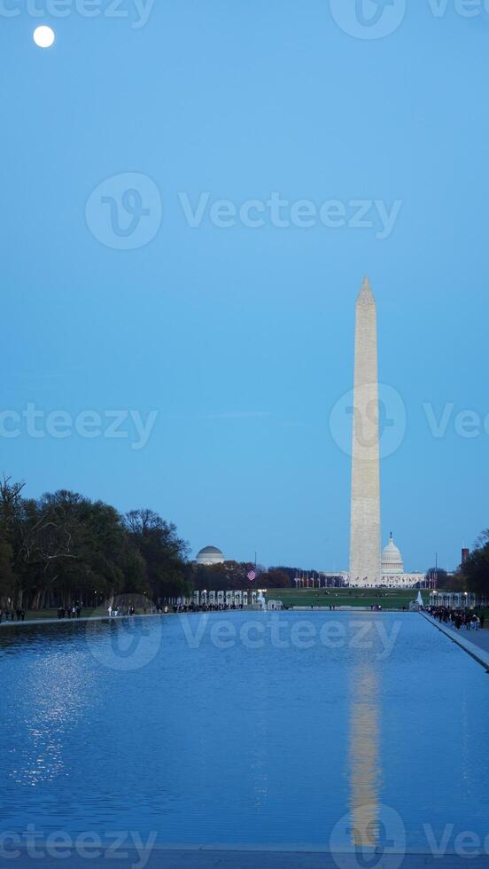 The monument tower view with the sunset sky as background in Washington DC photo