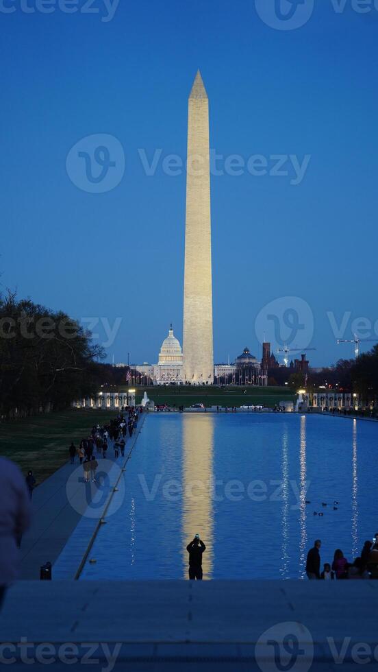 The monument tower view with the sunset sky as background in Washington DC photo