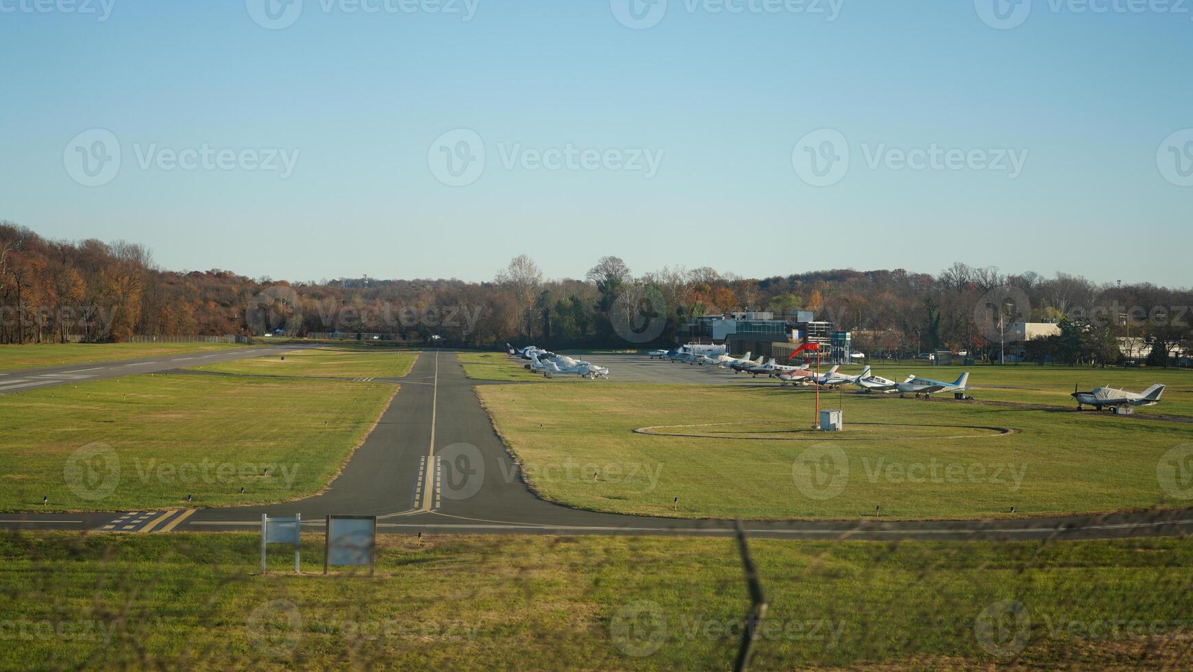 One airport view with several airplanes and runway photo