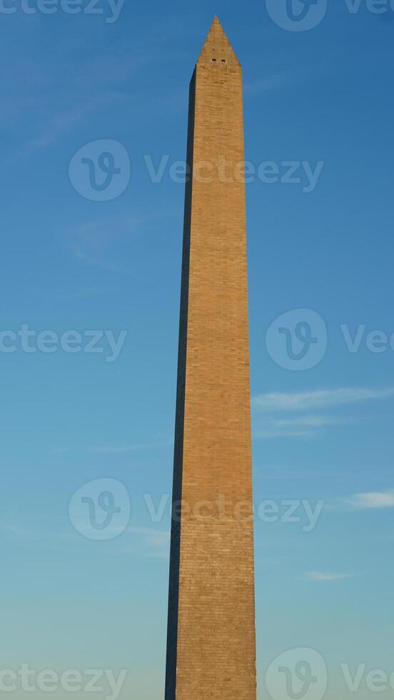 The monument tower view with the sunset sky as background in Washington DC photo