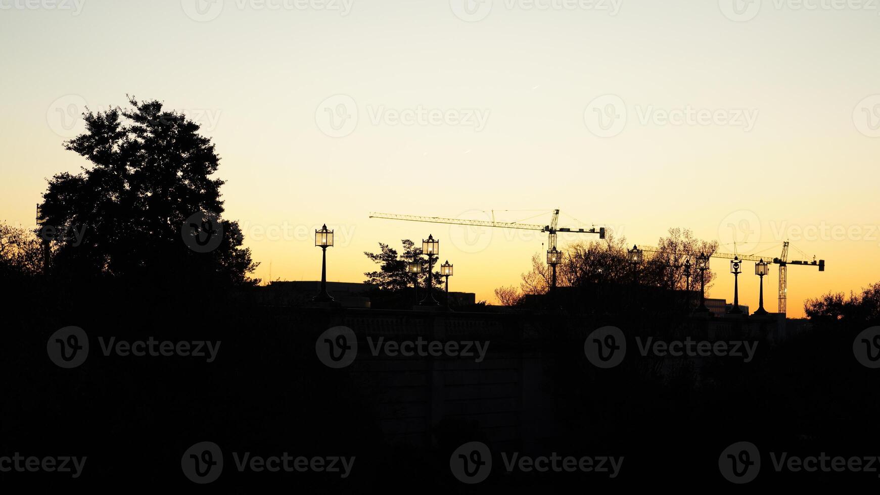 The beautiful sunset city view with the silhouette of the monument tower in Washington DC photo