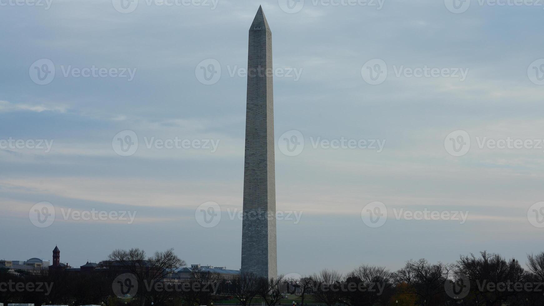 The monument tower view with the sunset sky as background in Washington DC photo