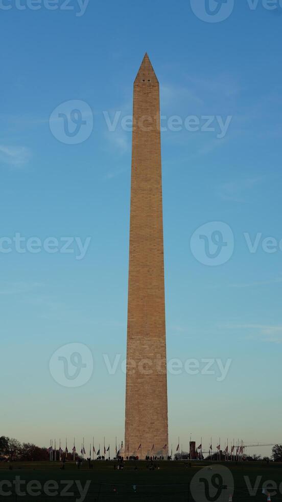 The monument tower view with the sunset sky as background in Washington DC photo