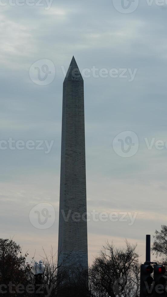 The monument tower view with the sunset sky as background in Washington DC photo