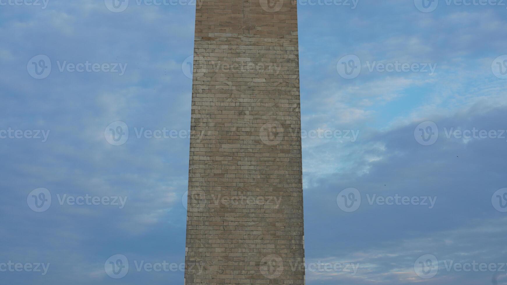 The monument tower view with the sunset sky as background in Washington DC photo