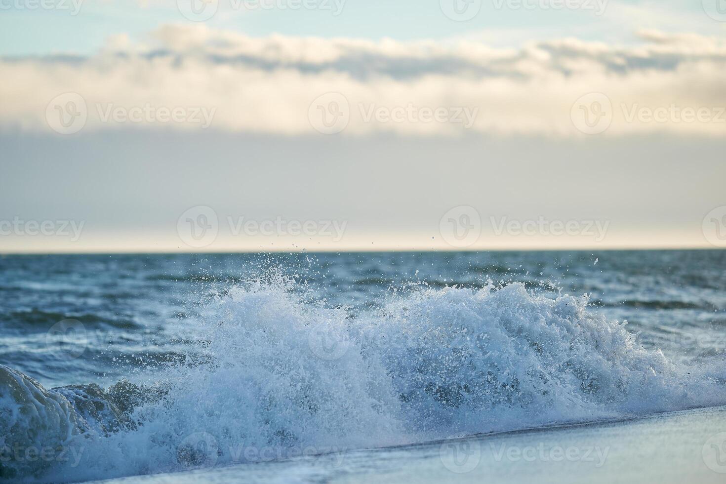 Spain Andalusia evening coast beach line waves on sand photo