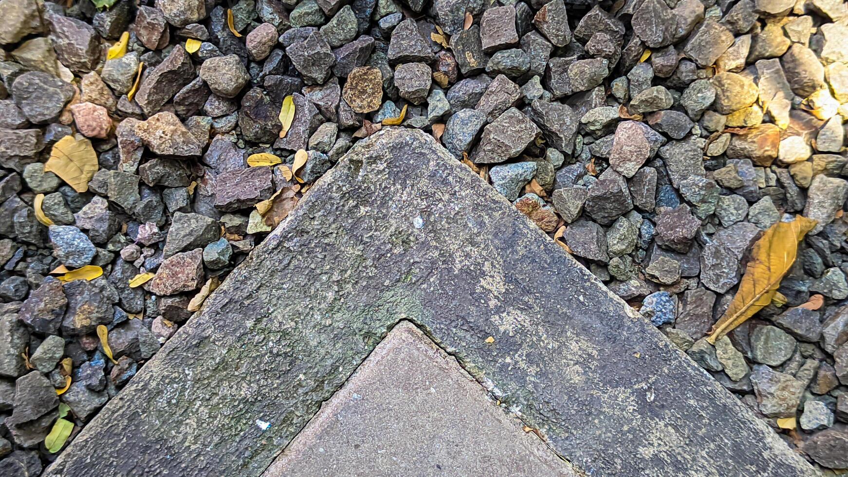 Close-Up of Gravel and Concrete Corner photo