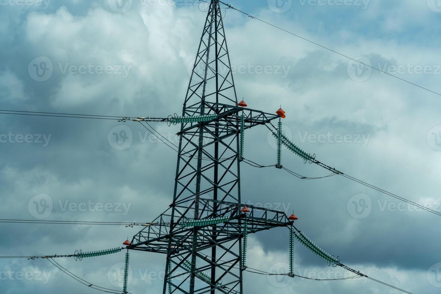 High voltage towers with sky background. Power line support with wires for electricity transmission. High voltage grid tower with wire cable at distribution station. Energy industry, energy saving photo