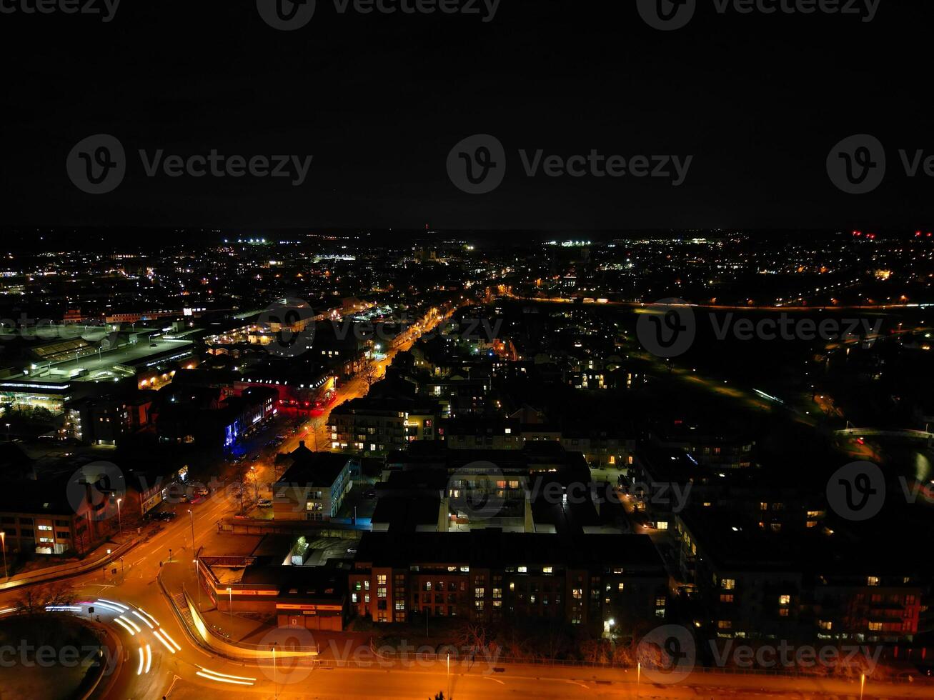 Aerial View of Illuminated Central Cambridge City of Cambridgeshire of England UK During Night. High Angle Footage Was Captured with Drone's Camera at Just After Sunset on March 22nd, 2024 photo