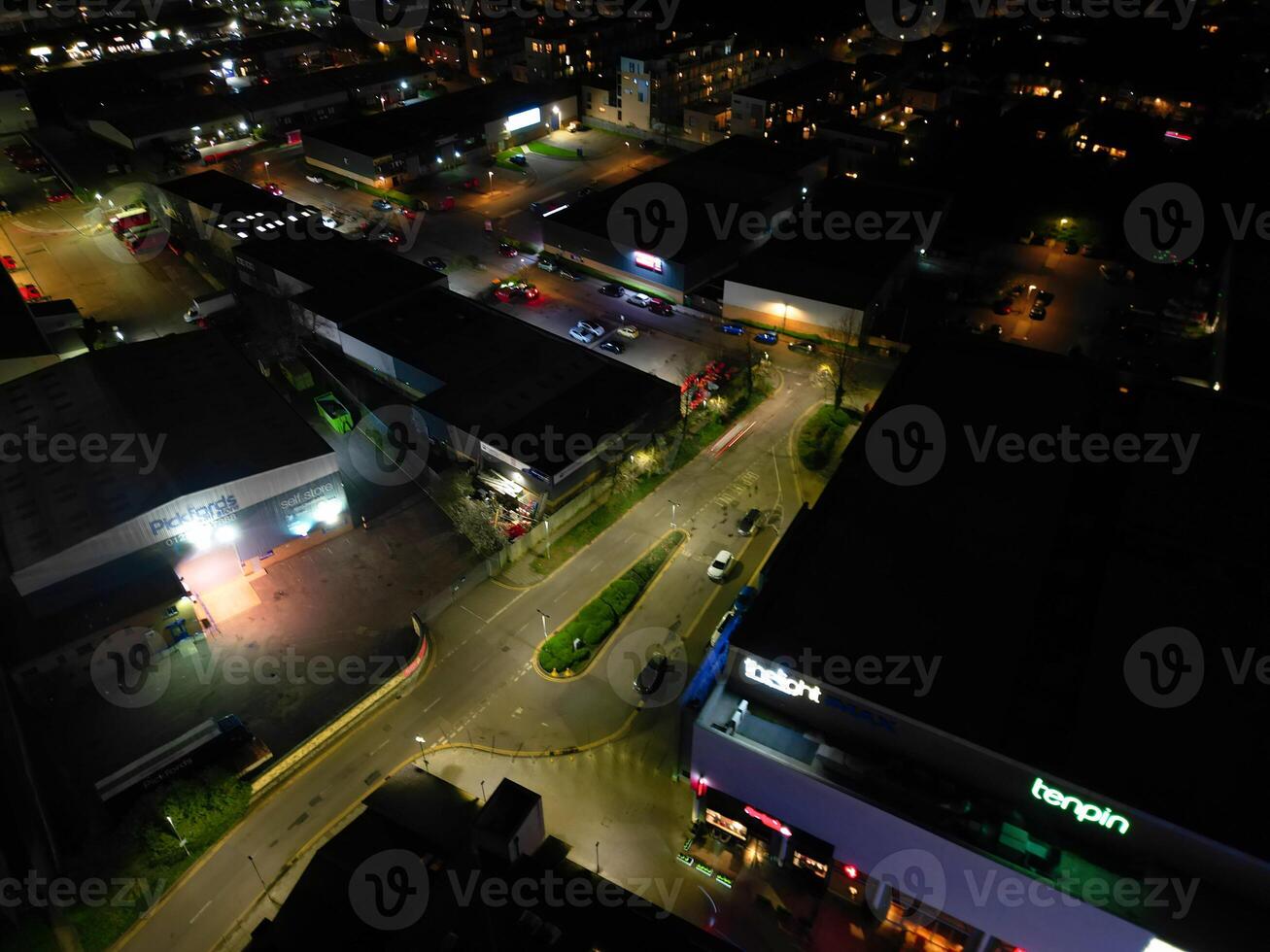 Aerial View of Illuminated Central Cambridge City of Cambridgeshire of England UK During Night. High Angle Footage Was Captured with Drone's Camera at Just After Sunset on March 22nd, 2024 photo
