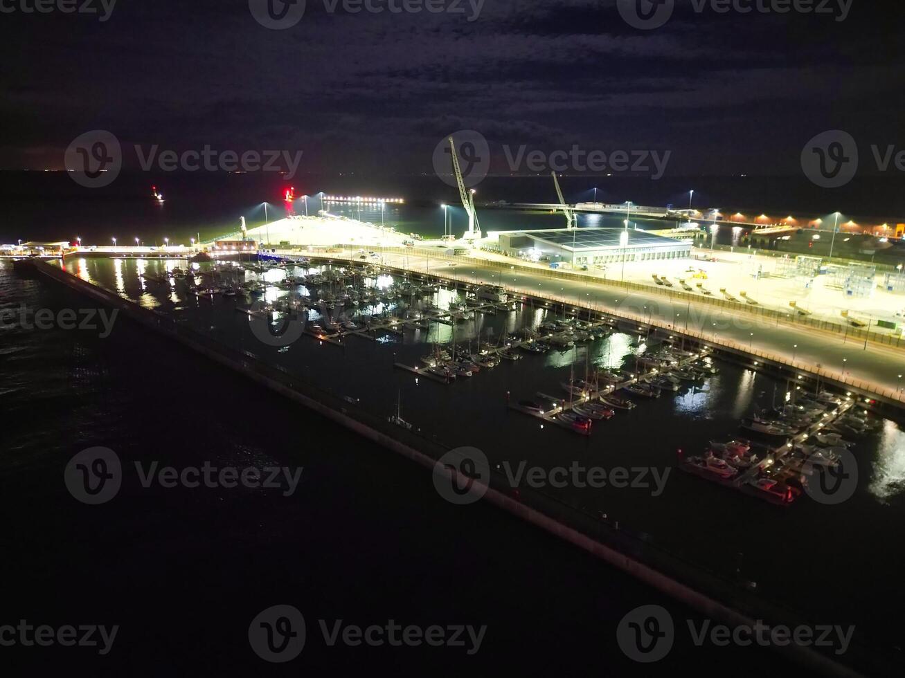 High Angle Night View of Dover Coastal City of South Eastern County of Kent England, United Kingdom. The Illuminated Footage Was Captured with Drone's Camera after Sunset Night of April 20th, 2024 photo
