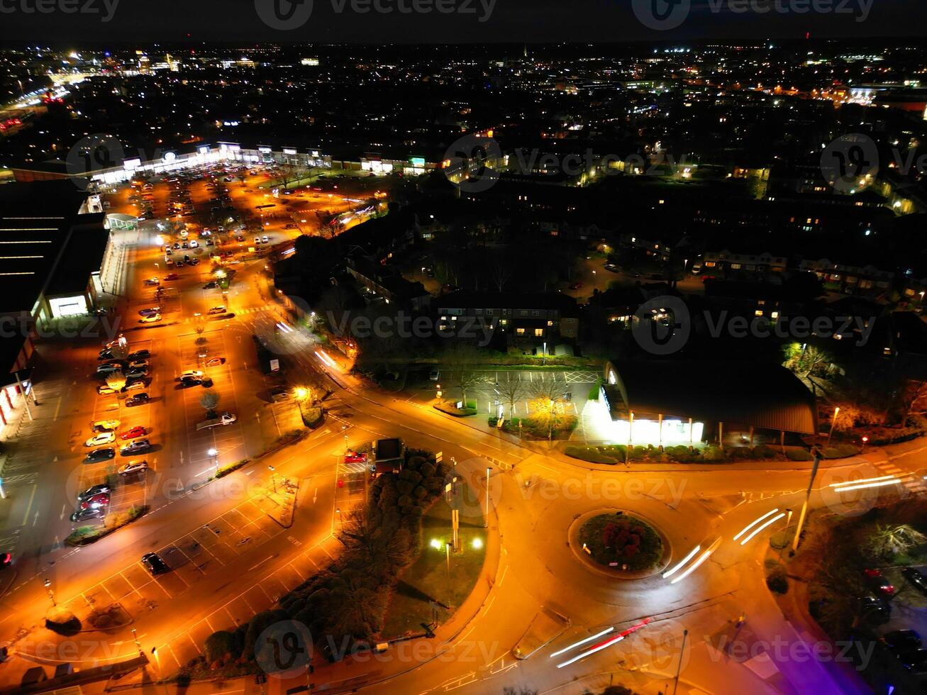 Aerial View of Illuminated Central Cambridge City of Cambridgeshire of England UK During Night. High Angle Footage Was Captured with Drone's Camera at Just After Sunset on March 22nd, 2024 photo