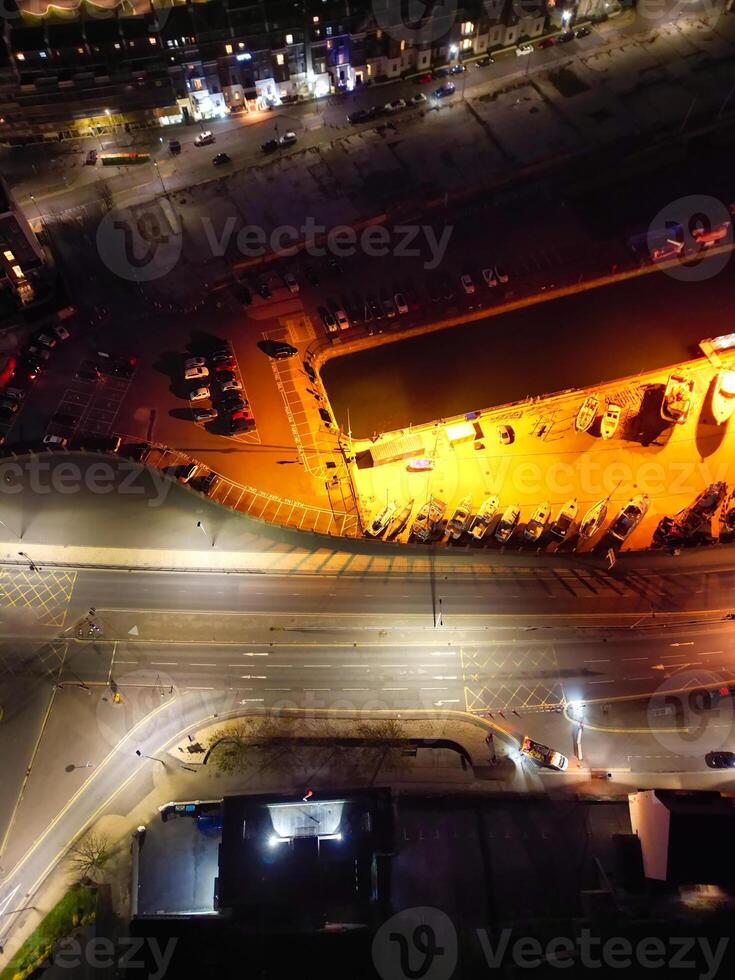 High Angle Night View of Dover Coastal City of South Eastern County of Kent England, United Kingdom. The Illuminated Footage Was Captured with Drone's Camera after Sunset Night of April 20th, 2024 photo