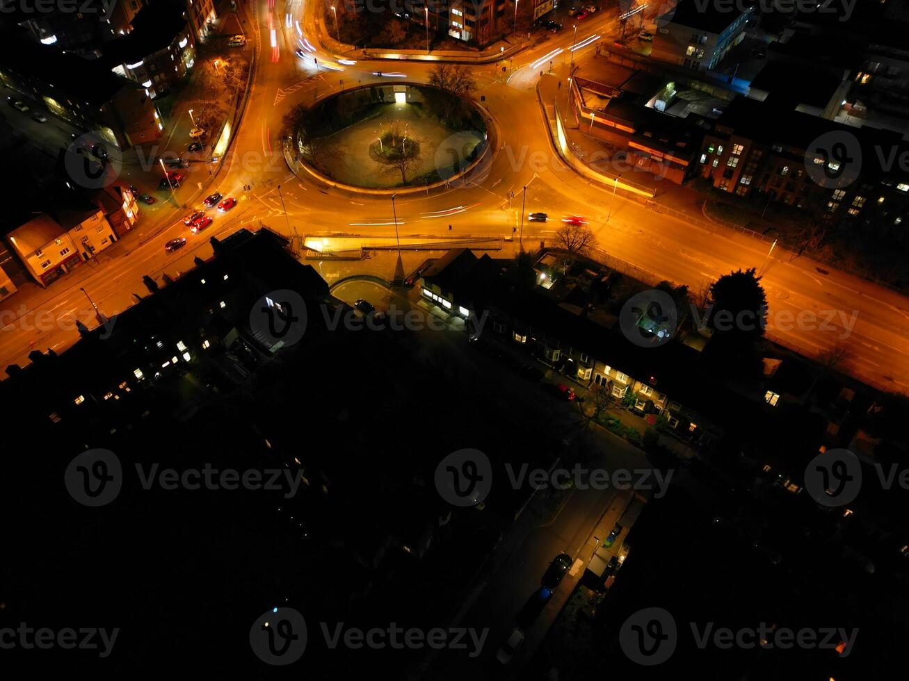 Aerial View of Illuminated Central Cambridge City of Cambridgeshire of England UK During Night. High Angle Footage Was Captured with Drone's Camera at Just After Sunset on March 22nd, 2024 photo