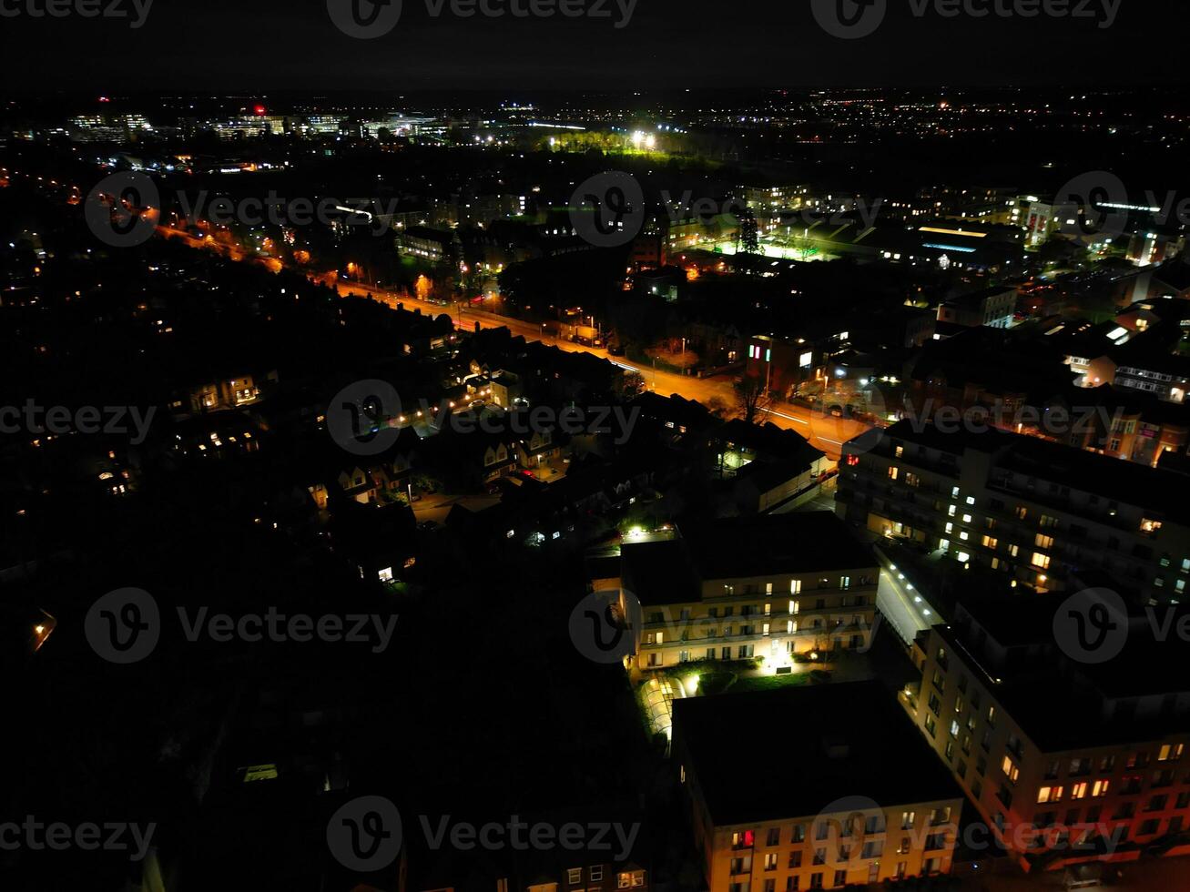 Aerial View of Illuminated Central Cambridge City of Cambridgeshire of England UK During Night. High Angle Footage Was Captured with Drone's Camera at Just After Sunset on March 22nd, 2024 photo