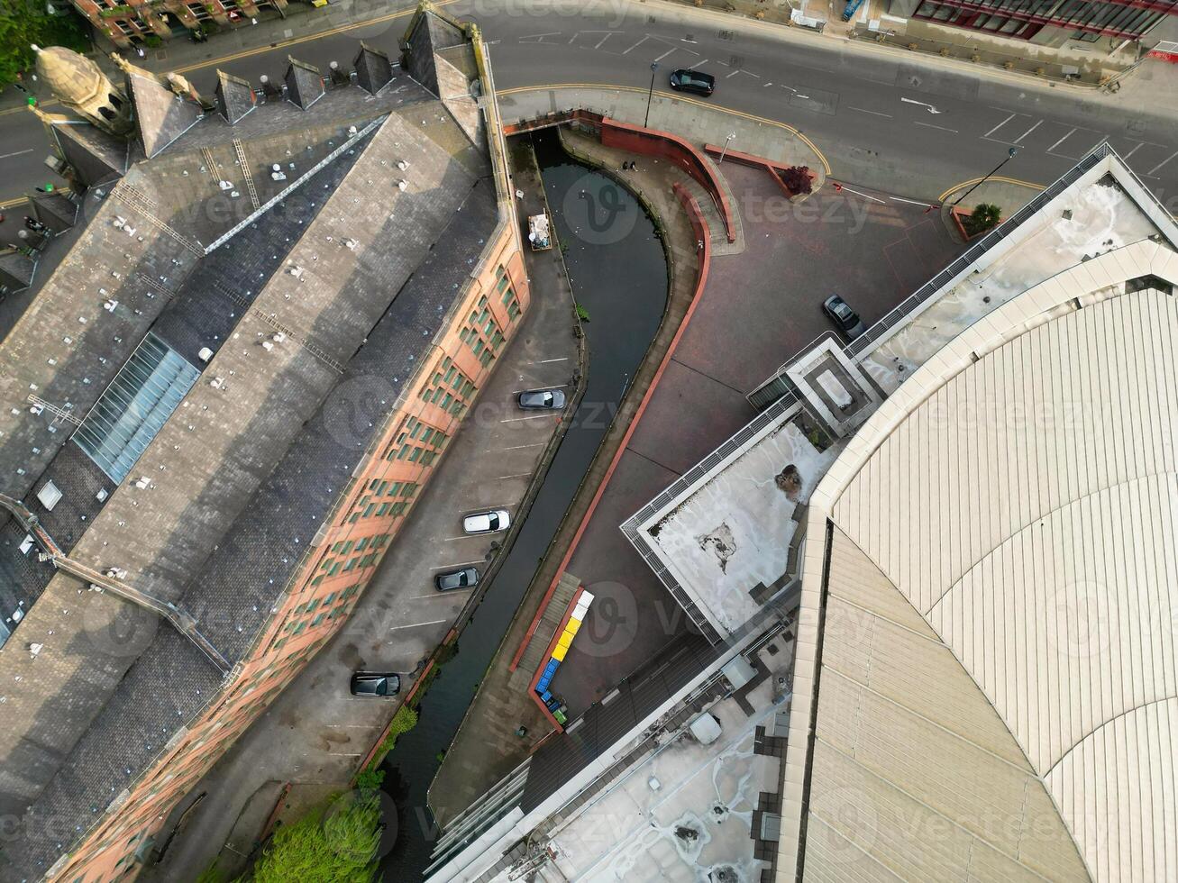 Iconic Buildings at Central Greater Manchester City Centre and Tall Buildings During Golden Hour of Sunset over England UK. Aerial Footage Was Captured with Drone's Camera on May 5th, 2024. photo