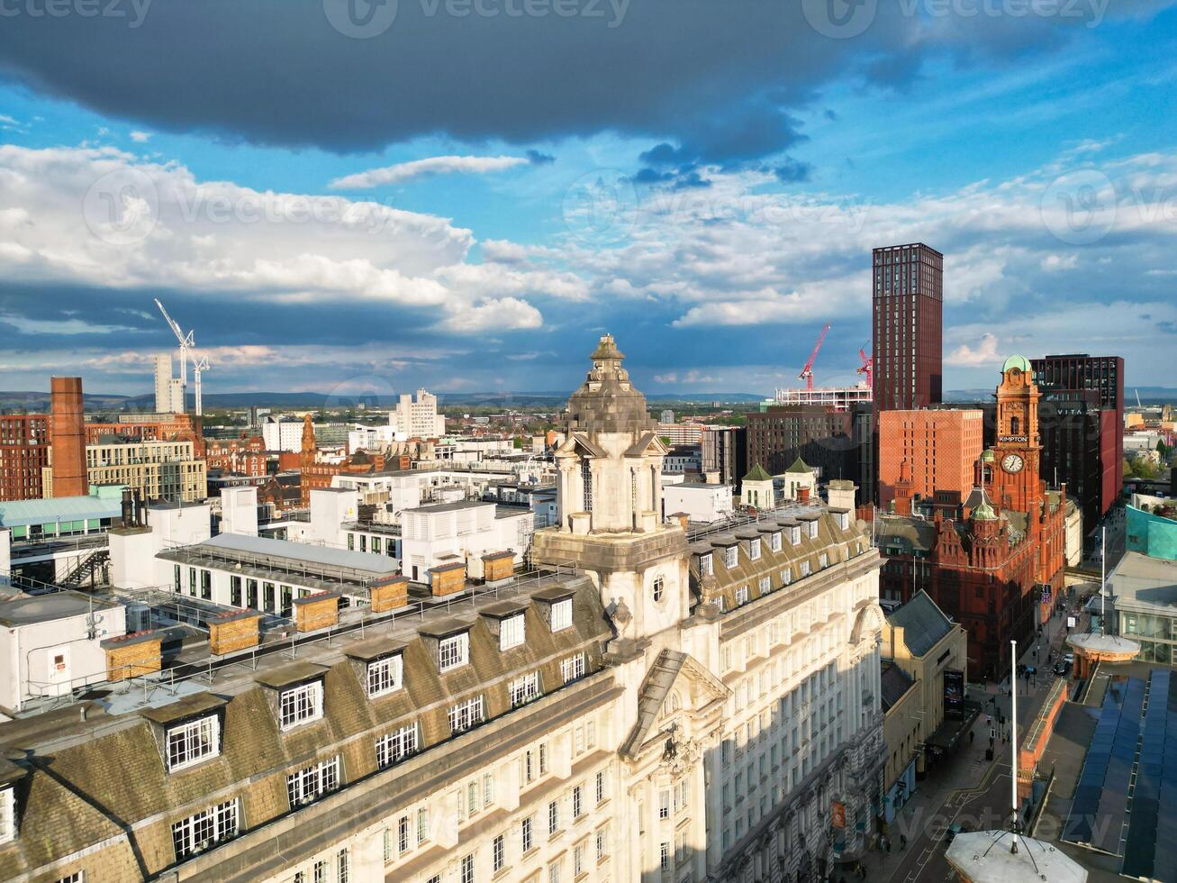 Iconic Buildings at Central Greater Manchester City Centre and Tall Buildings During Golden Hour of Sunset over England UK. Aerial Footage Was Captured with Drone's Camera on May 5th, 2024. photo