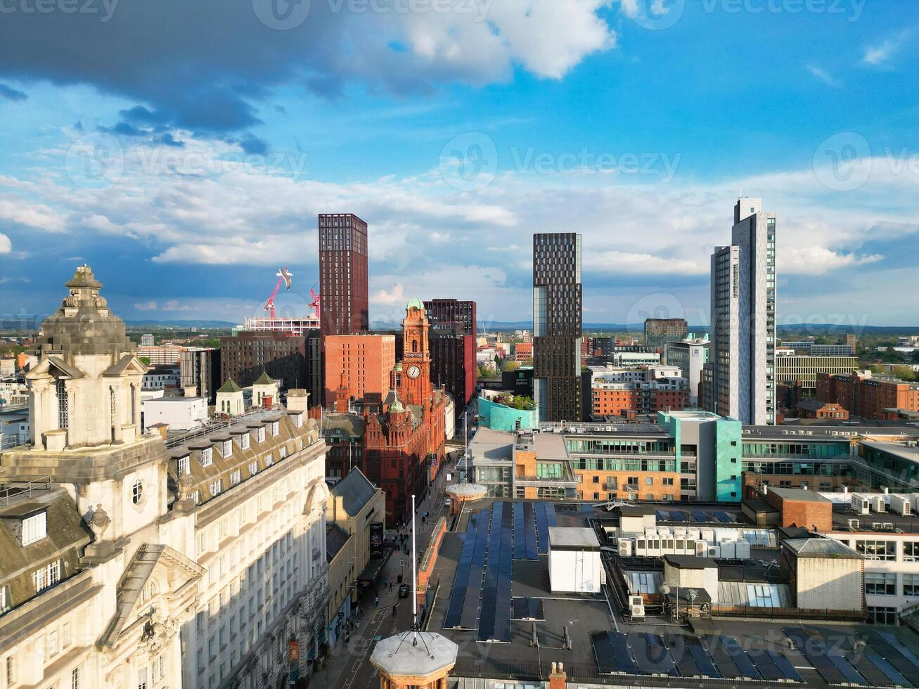 Iconic Buildings at Central Greater Manchester City Centre and Tall Buildings During Golden Hour of Sunset over England UK. Aerial Footage Was Captured with Drone's Camera on May 5th, 2024. photo