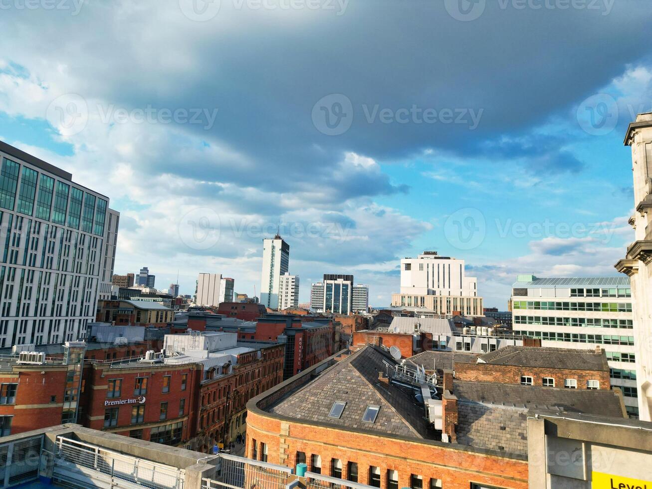 Iconic Buildings at Central Greater Manchester City Centre and Tall Buildings During Golden Hour of Sunset over England UK. Aerial Footage Was Captured with Drone's Camera on May 5th, 2024. photo