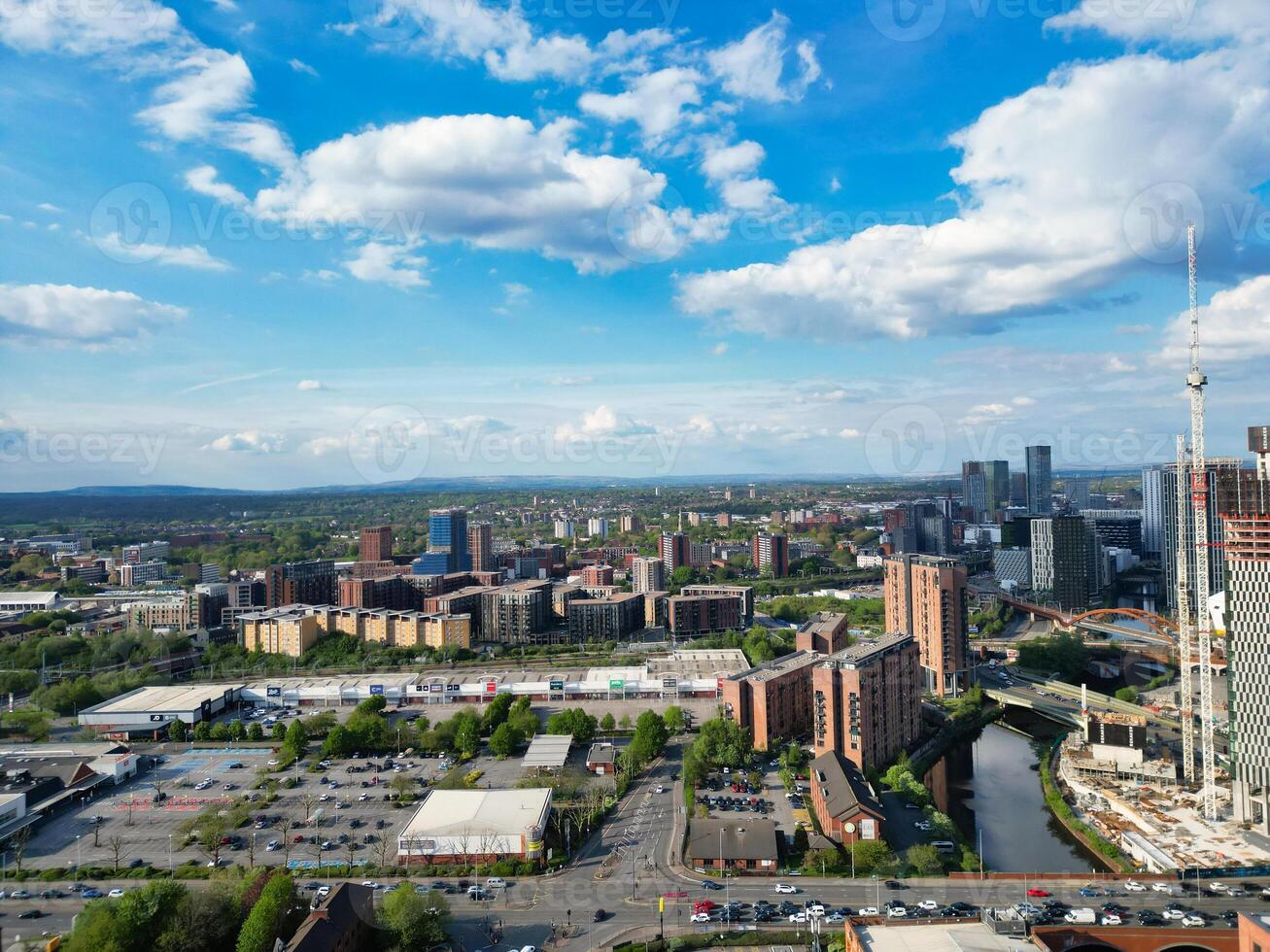 Iconic Buildings at Central Greater Manchester City Centre and Tall Buildings During Golden Hour of Sunset over England UK. Aerial Footage Was Captured with Drone's Camera on May 5th, 2024. photo