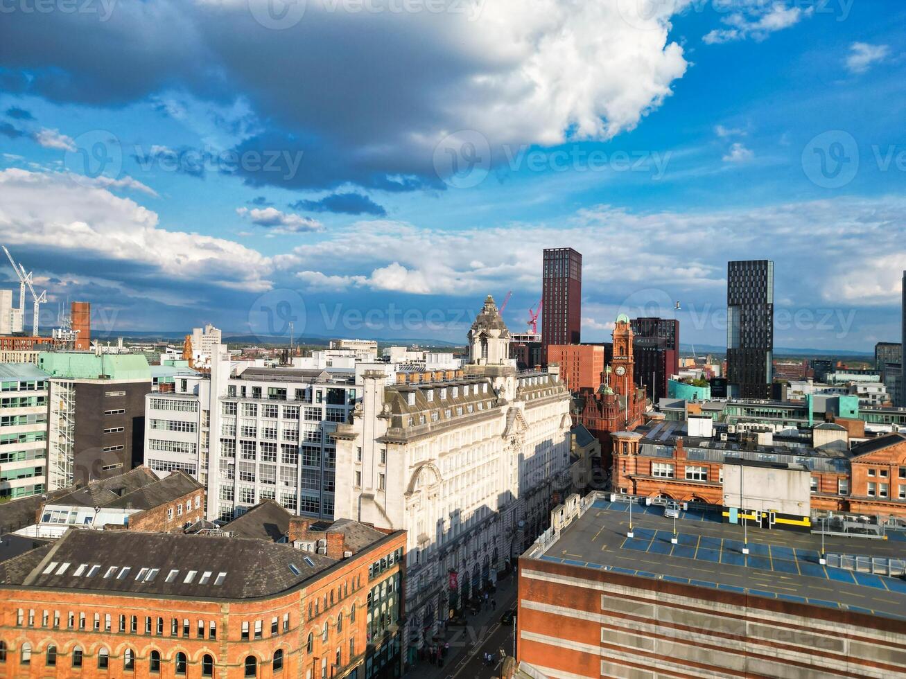 Iconic Buildings at Central Greater Manchester City Centre and Tall Buildings During Golden Hour of Sunset over England UK. Aerial Footage Was Captured with Drone's Camera on May 5th, 2024. photo