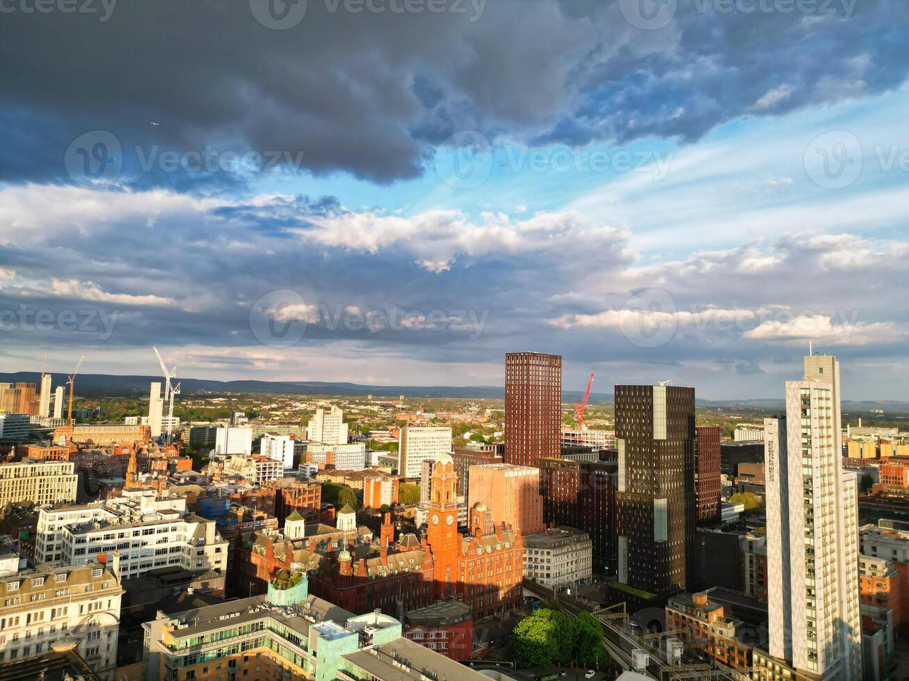 Iconic Buildings at Central Greater Manchester City Centre and Tall Buildings During Golden Hour of Sunset over England UK. Aerial Footage Was Captured with Drone's Camera on May 5th, 2024. photo