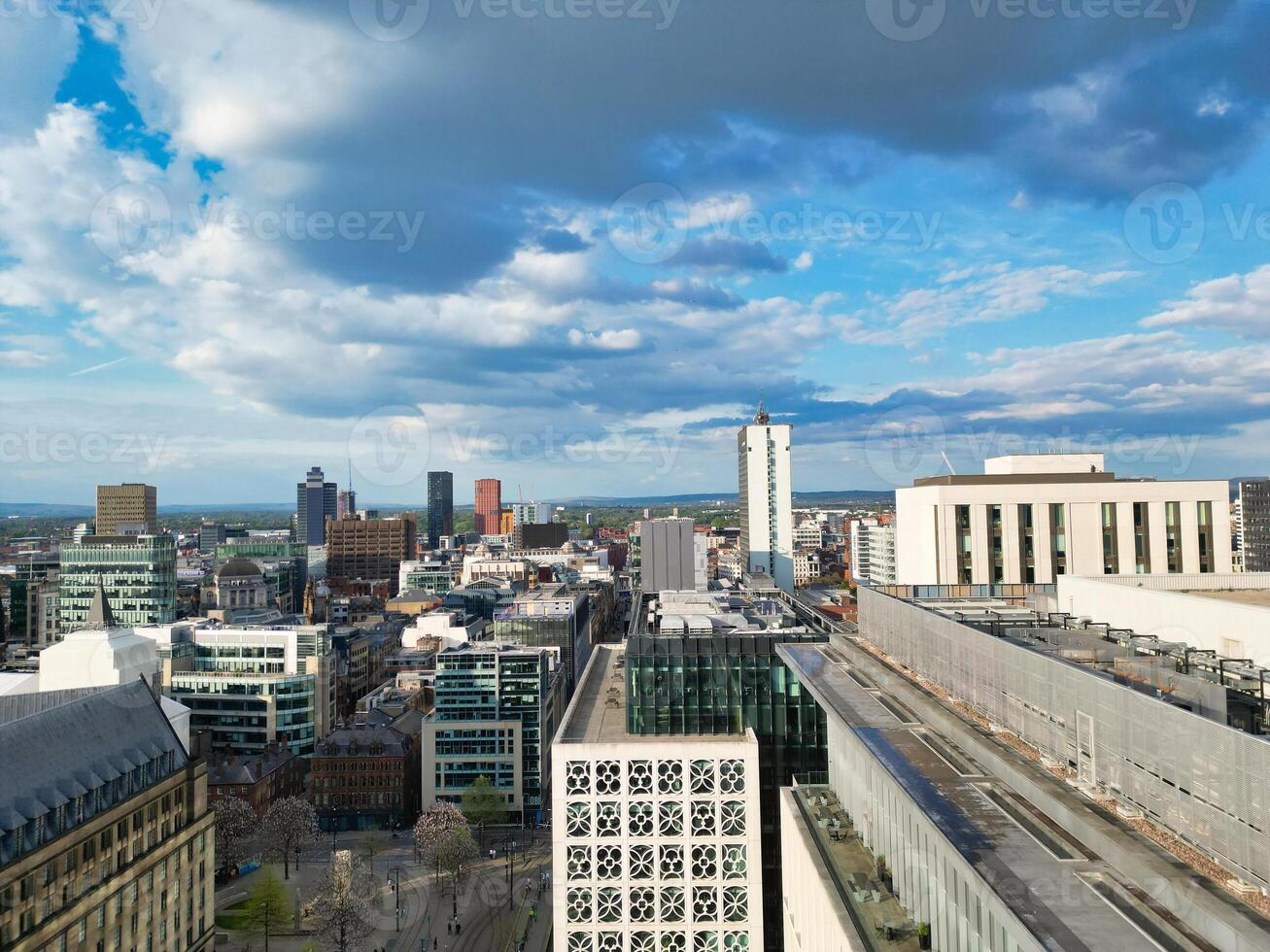 Iconic Buildings at Central Greater Manchester City Centre and Tall Buildings During Golden Hour of Sunset over England UK. Aerial Footage Was Captured with Drone's Camera on May 5th, 2024. photo
