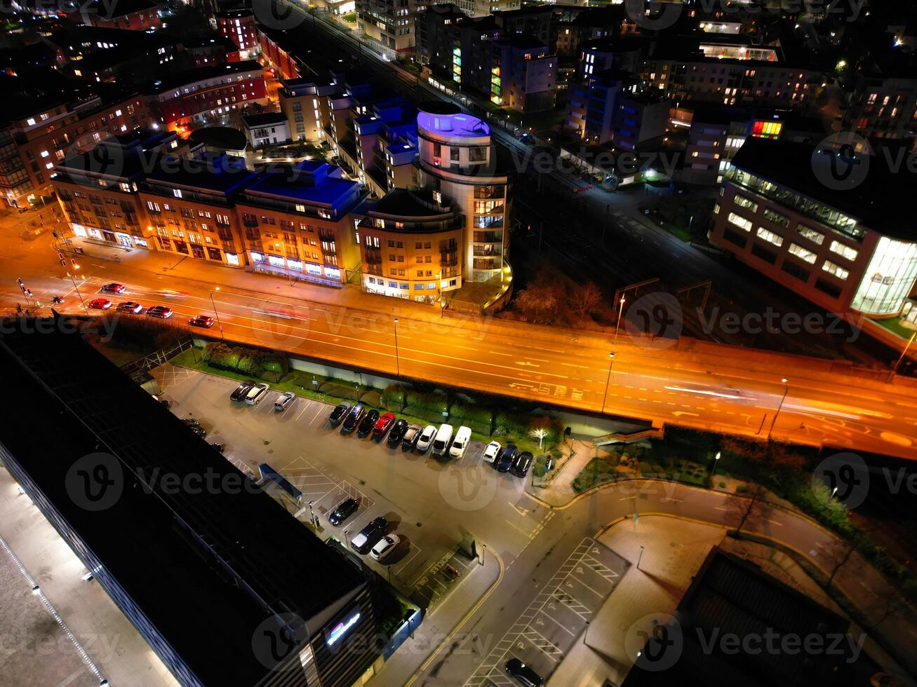 Aerial View of Illuminated Central Cambridge City of Cambridgeshire of England UK During Night. High Angle Footage Was Captured with Drone's Camera at Just After Sunset on March 22nd, 2024 photo