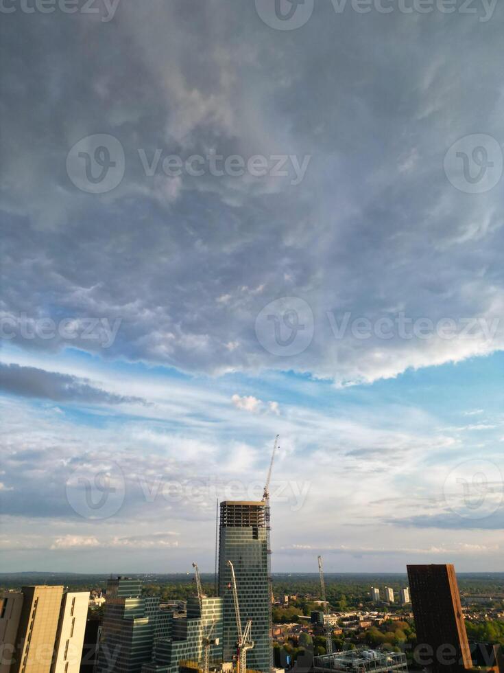 Iconic Buildings at Central Greater Manchester City Centre and Tall Buildings During Golden Hour of Sunset over England UK. Aerial Footage Was Captured with Drone's Camera on May 5th, 2024. photo