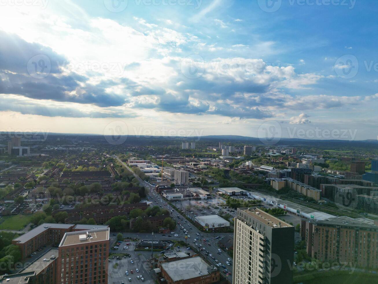 Iconic Buildings at Central Greater Manchester City Centre and Tall Buildings During Golden Hour of Sunset over England UK. Aerial Footage Was Captured with Drone's Camera on May 5th, 2024. photo