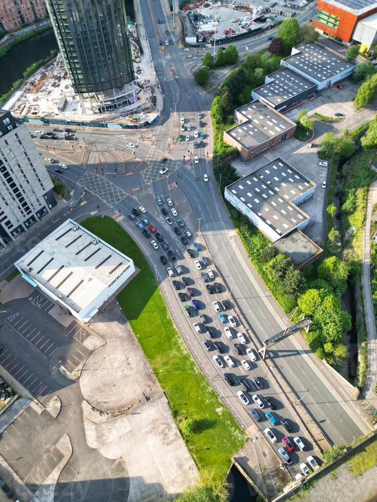 Iconic Buildings at Central Greater Manchester City Centre and Tall Buildings During Golden Hour of Sunset over England UK. Aerial Footage Was Captured with Drone's Camera on May 5th, 2024. photo