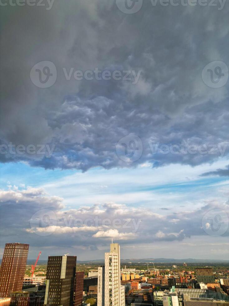 Iconic Buildings at Central Greater Manchester City Centre and Tall Buildings During Golden Hour of Sunset over England UK. Aerial Footage Was Captured with Drone's Camera on May 5th, 2024. photo