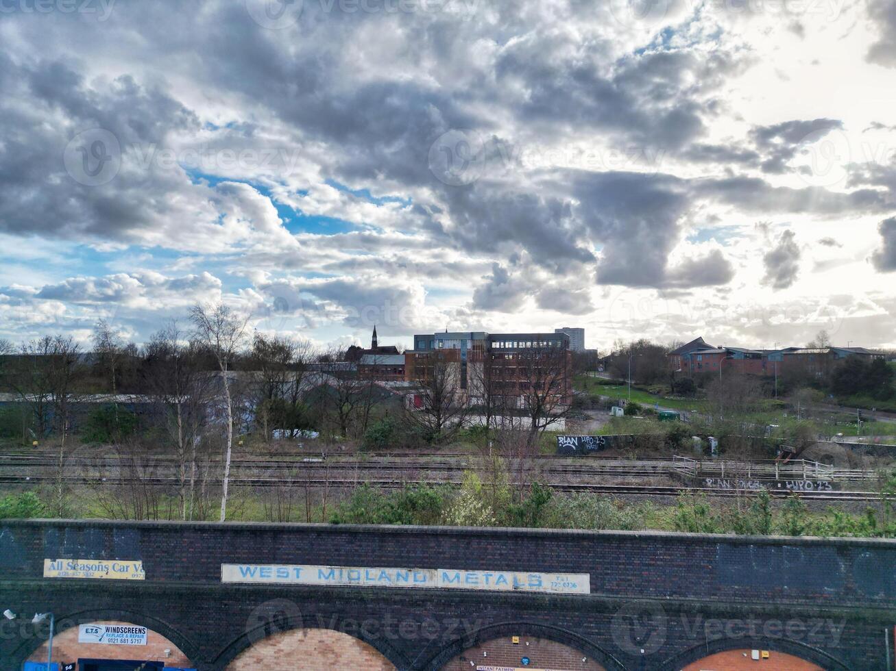Aerial View of Residential District at Birmingham City of Midlands, England, United Kingdom. Drone Camera Footage was Captured from High Altitude During Sunset Time of March 30th, 2024. photo