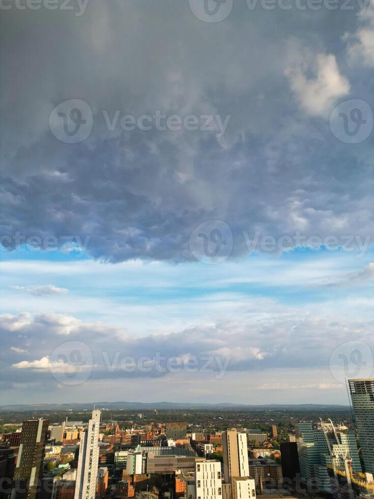 Iconic Buildings at Central Greater Manchester City Centre and Tall Buildings During Golden Hour of Sunset over England UK. Aerial Footage Was Captured with Drone's Camera on May 5th, 2024. photo